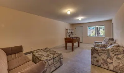 a living room with a couch and a table at Casa Del Lago - Only 200 Yards from the Beach in Groveland