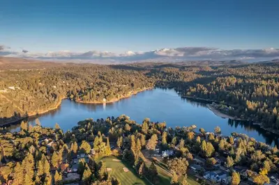 an aerial view of a lake with trees and houses at Casa Del Lago - Only 200 Yards from the Beach in Groveland