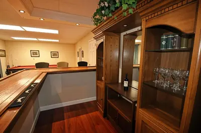 a wine tasting room with a bar with wine glasses at Yosemite Villa - Only 0,3 Miles from Lake Lodge Beach and Playground in Groveland