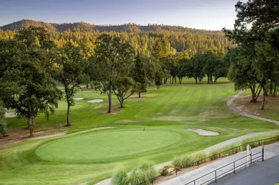 an aerial view of a golf course with trees at Rustic Modern Cabina De Alba in Groveland