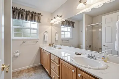a bathroom with two sinks and a large mirror at Star of the Mountain Yosemite Home in Groveland