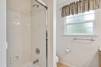 a bathroom with a shower and a toilet at Star of the Mountain Yosemite Home in Groveland