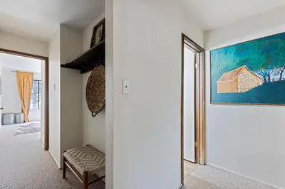 a room with a hallway with a painting on the wall at Luxurious 2 Bedroom Base Camp Condo - Steps from Kirkwood Village condo in Kirkwood