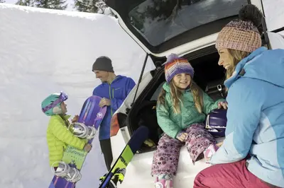a group of people sitting in the back of a car at Luxurious 2 Bedroom Base Camp Condo - Steps from Kirkwood Village condo in Kirkwood