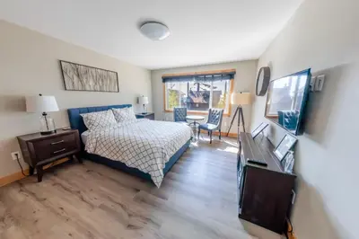 a bedroom with a bed and a table and chairs at Lakeside Hotel room #2 in Kings Beach in Kings Beach