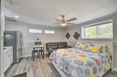a small bedroom with a bed and a kitchen at Cute Central Placerville Studio Pet Friendly in Placerville