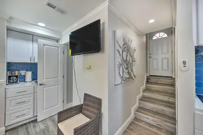 a room with a hallway with a tv on a wall at Cute Central Placerville Studio Pet Friendly in Placerville