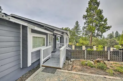 a house with a porch and a fence at Less Than 3 Mi to Dtwn Placerville Home with Outdoor Oasis in Placerville