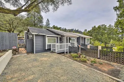 a house with a fence in front of it at Less Than 3 Mi to Dtwn Placerville Home with Outdoor Oasis in Placerville