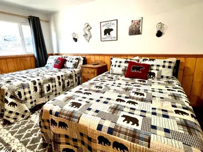 a bedroom with two beds with bears on them at Top rated cabin w/spa Walk to the Village & Golf in Mammoth Lakes