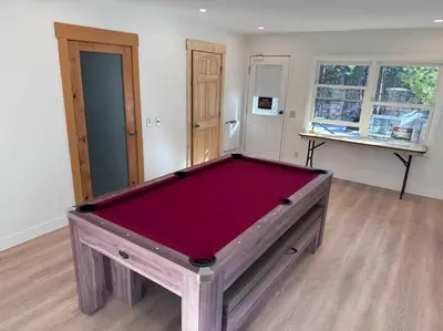 a pool table in the middle of a room at Top rated cabin w/spa Walk to the Village & Golf in Mammoth Lakes