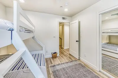 a room with two bunk beds and a closet at Slide Creek Retreat in Bass Lake