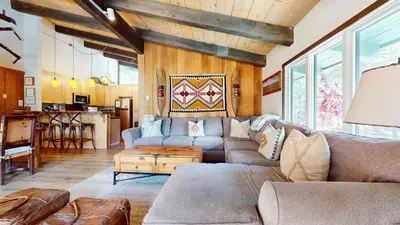 a living room with a couch and a table at Chateau Sans Nom #19 condo in Mammoth Lakes