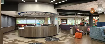 a lobby of a hospital with a waiting room with chairs at Tru By Hilton Manteca in Manteca
