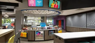 a fast food restaurant with a waiting area with food at Tru By Hilton Manteca in Manteca