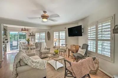 a living room filled with furniture and a flat screen tv at 1 Mi to Jenkinson Lake Apples Chalet with Deck in Pollock Pines