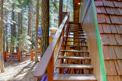 a staircase leading up to a cabin in the woods at Chapel Grove in Tahoe City