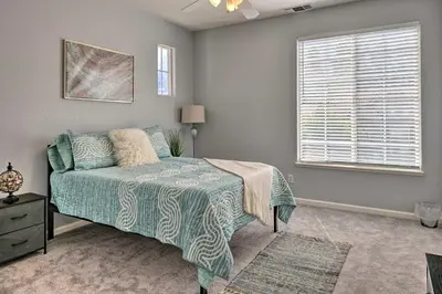 a bedroom with a bed and a window at Family-Friendly Modesto Home with Grill and Yard in Modesto