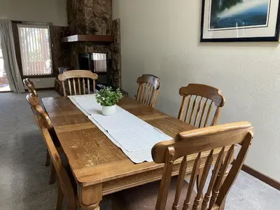 a wooden dining table with four chairs at Tahoe Enchantment in Zephyr Cove