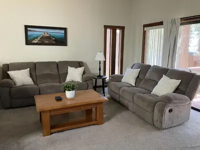 a living room with a couch and a coffee table at Tahoe Enchantment in Zephyr Cove