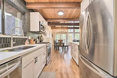 a kitchen with a stainless steel refrigerator in it at 2 Mi to Tahoe Donner Ski Resort Forest-View Haven in Truckee