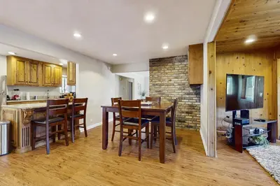 a kitchen and dining room with a table and chairs at Escape at Edgewood in Stateline