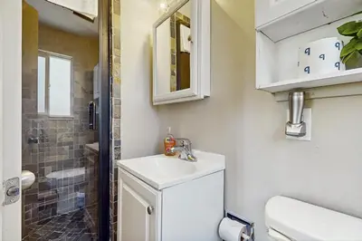 a bathroom with a toilet and a sink and a shower at Escape at Edgewood in Stateline