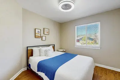 a bedroom with a large bed with a window at Escape at Edgewood in Stateline