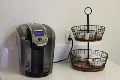 a coffee machine sitting on a counter with two baskets at Gateway Retreat: Short Drive to the Sequoias in Exeter