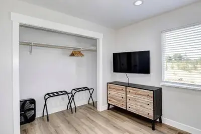 a living room with a flat screen tv and two chairs at New Listing Country Property Pet Friendly W&D in Loomis