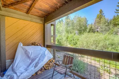 a porch with a chair and a window at Silver Strike Sanctuary in Truckee
