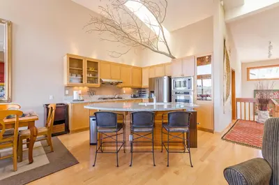 a kitchen with a table and chairs in a room at Snowcreek V 984 in Mammoth Lakes