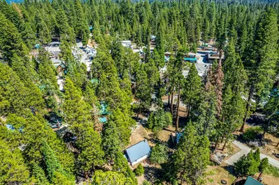 an aerial view of a campground in a forest at Alpine Cottage in Shaver Lake