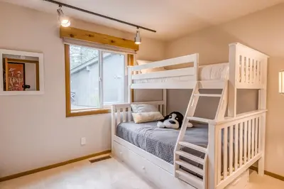 a room with bunk beds in a house at Basque in Nature in Truckee