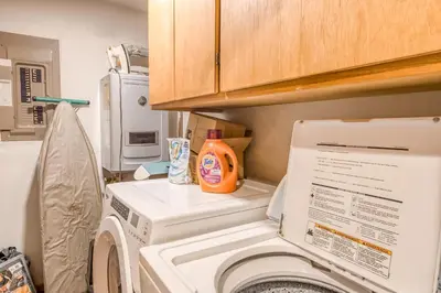 a washer and dryer in a small kitchen with at Basque in Nature in Truckee