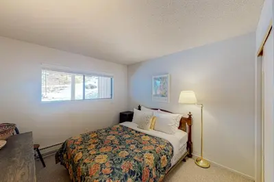 a bedroom with a bed and a window at Falcon Nest in Incline Village