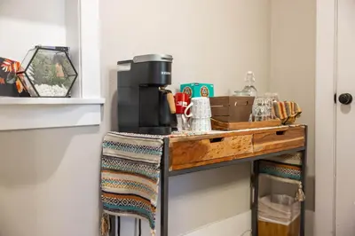 a table with a coffee maker on top of it at 738 E Yale in Fresno