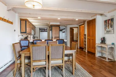 a dining room with a table and chairs at Walk to Lift Updated 2 Bedroom 2 and a Half Bathrooms 1849 Condos 209 Steps to Canyon Lodge Sleeps 6 in Mammoth Lakes