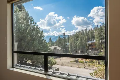 a window with a view of a mountain view at Walk to Lift Updated 2 Bedroom 2 and a Half Bathrooms 1849 Condos 209 Steps to Canyon Lodge Sleeps 6 in Mammoth Lakes