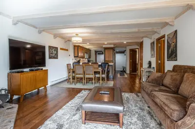 a living room with a couch and a table at Walk to Lift Updated 2 Bedroom 2 and a Half Bathrooms 1849 Condos 209 Steps to Canyon Lodge Sleeps 6 in Mammoth Lakes
