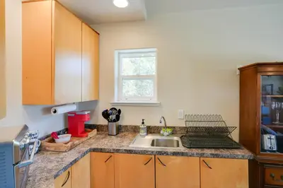 a kitchen with a sink and a window at Colfax Getaway with Hot Tub, Mountain Views! in Colfax
