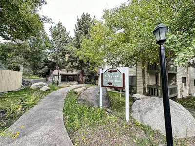 a sign in front of a house with a street light at La Vista Blanc #59 condo in Mammoth Lakes