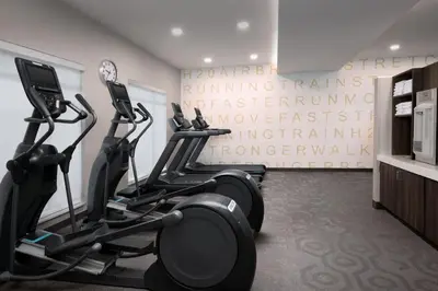 a gym with two tread machines in a room at Residence Inn by Marriott Fresno Clovis in Clovis