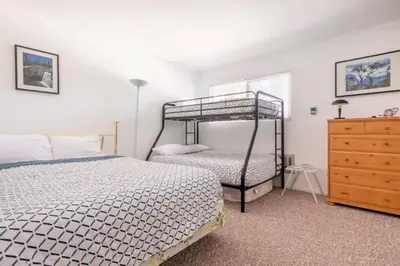 a bedroom with two bunk beds and a dresser at Perfect Ski Rental 2 blocks from Village Gondola in Mammoth Lakes
