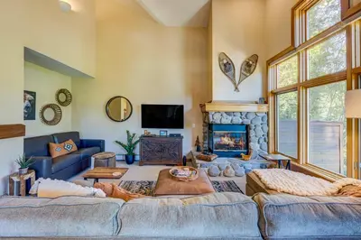 a living room with a couch and a fireplace at Incline Escape in Incline Village
