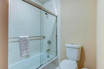 a bathroom with a toilet and a glass shower at Incline Escape in Incline Village
