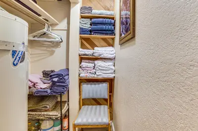 a walk in closet with a chair and towels at Cozy Mammoth Lakes Studio 5 Mi to Ski Slopes in Mammoth Lakes