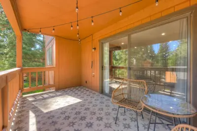 a screened porch with a table and chairs on it at Incline Village Stunner in Incline Village