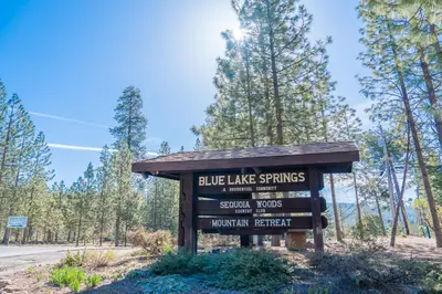 a sign for blue lake springs at the beginning of the trail at Sweet Arnold Cabin in Arnold