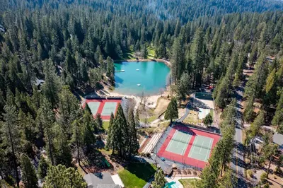 an aerial view of a lake with trees at Sweet Arnold Cabin in Arnold